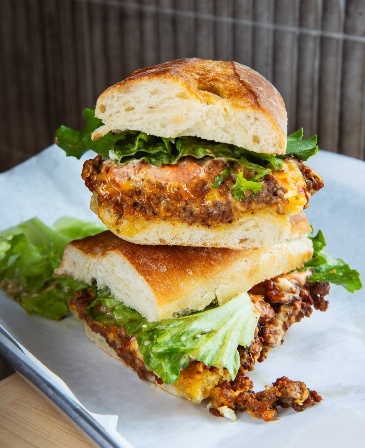 Stacked chopped cheese bagel sandwich